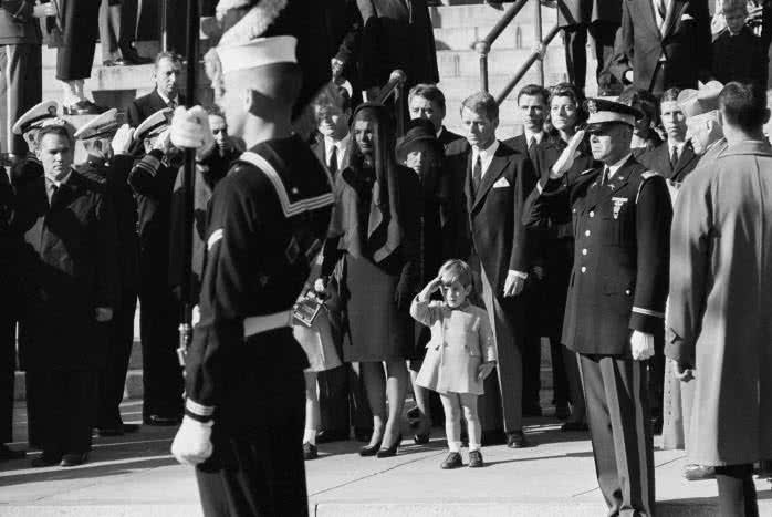 John F Kennedy Junior salutes his father's coffin